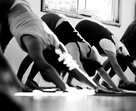Black and white image of women in a yoga class